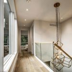 custom-home-hallway-with-glass-railings-and-stretch-ceiling-interior-designer-oakville