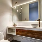 modern-bathroom-with-backlit-mirror-and-custom-vanity-bathroom-renovation-company