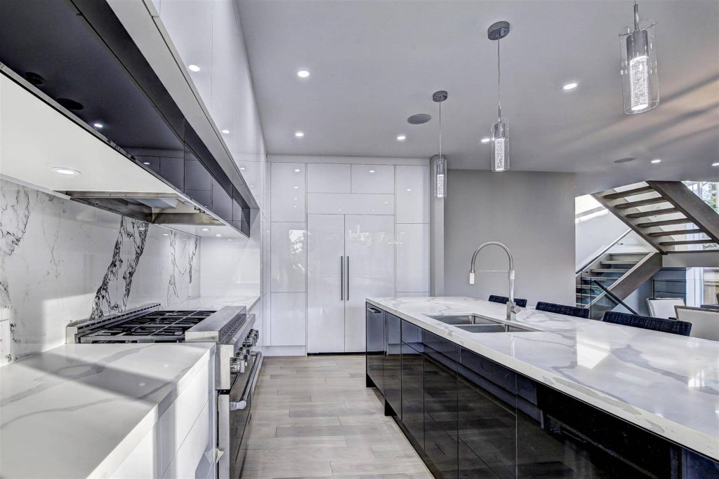 Reflective White Kitchen Cabinets in Custom Kitchen - Kitchen Designers